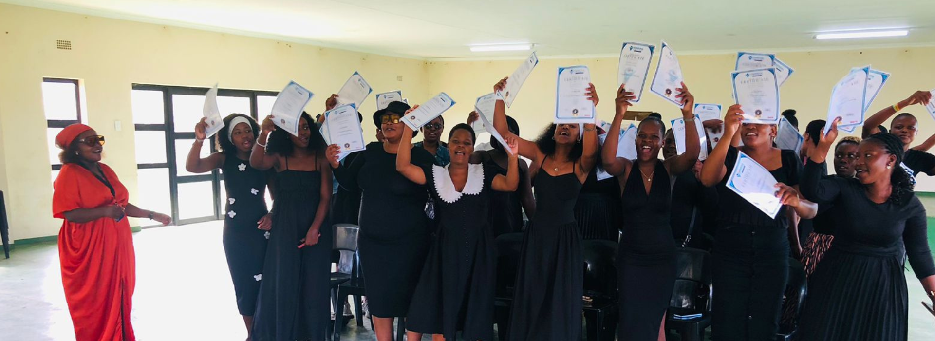 Nonqoma College graduates celebrating with their certificates